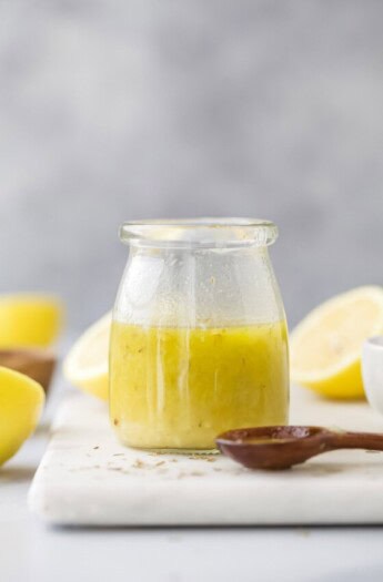 Homemade lemon vinaigrette in a glass jar.