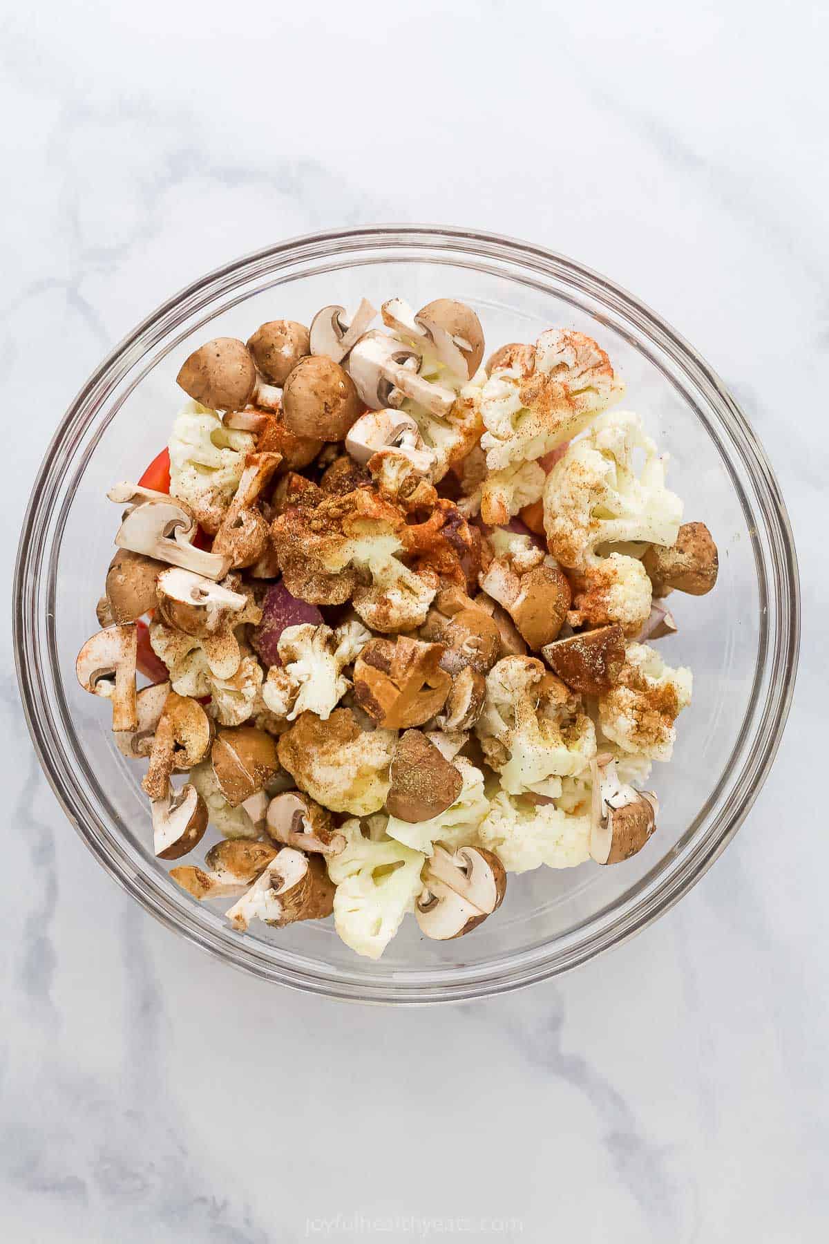 Adding wet and seasoning to a large bowl. 