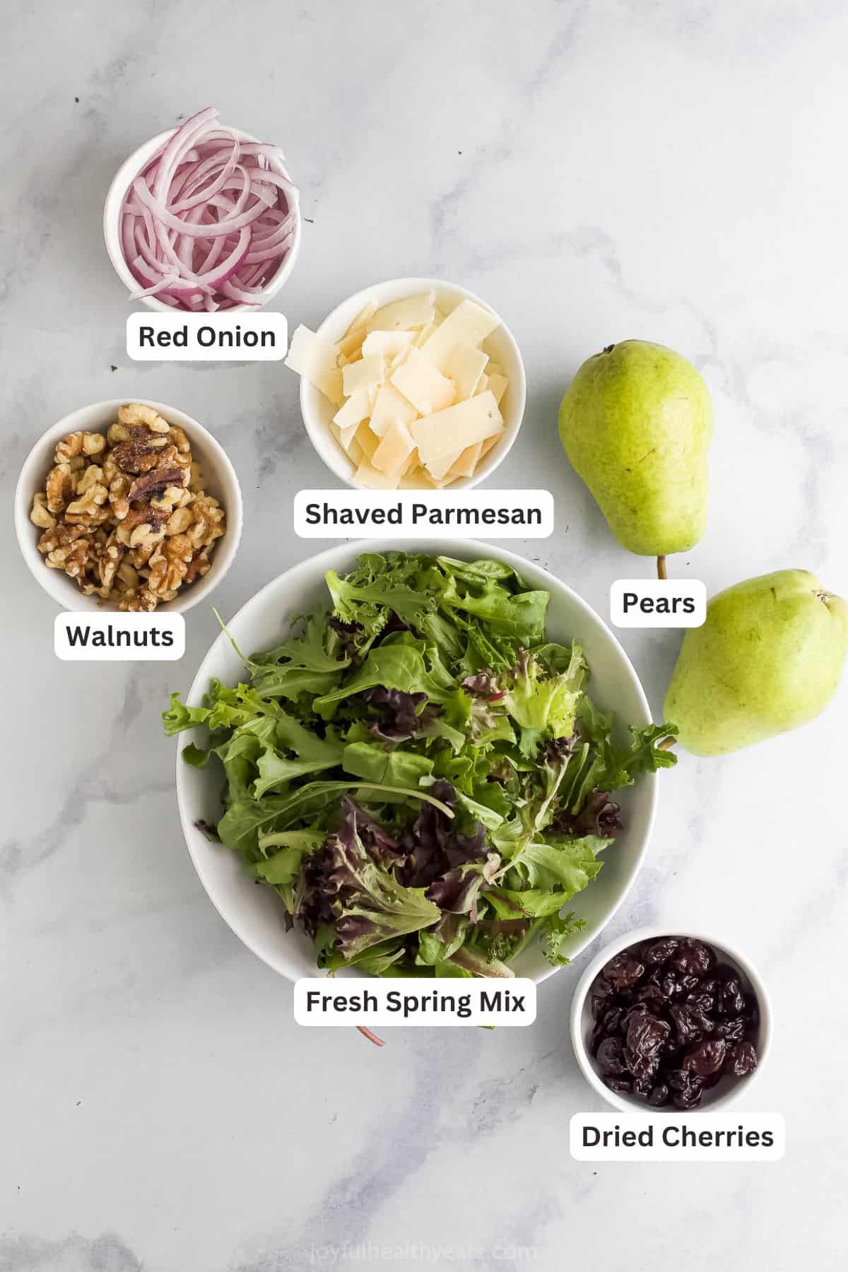 Labeled ingredients for making Pear Walnut Salad.