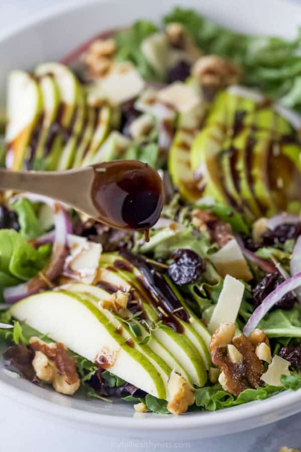 Drizzle the balsamic vinaigrette over the salad.