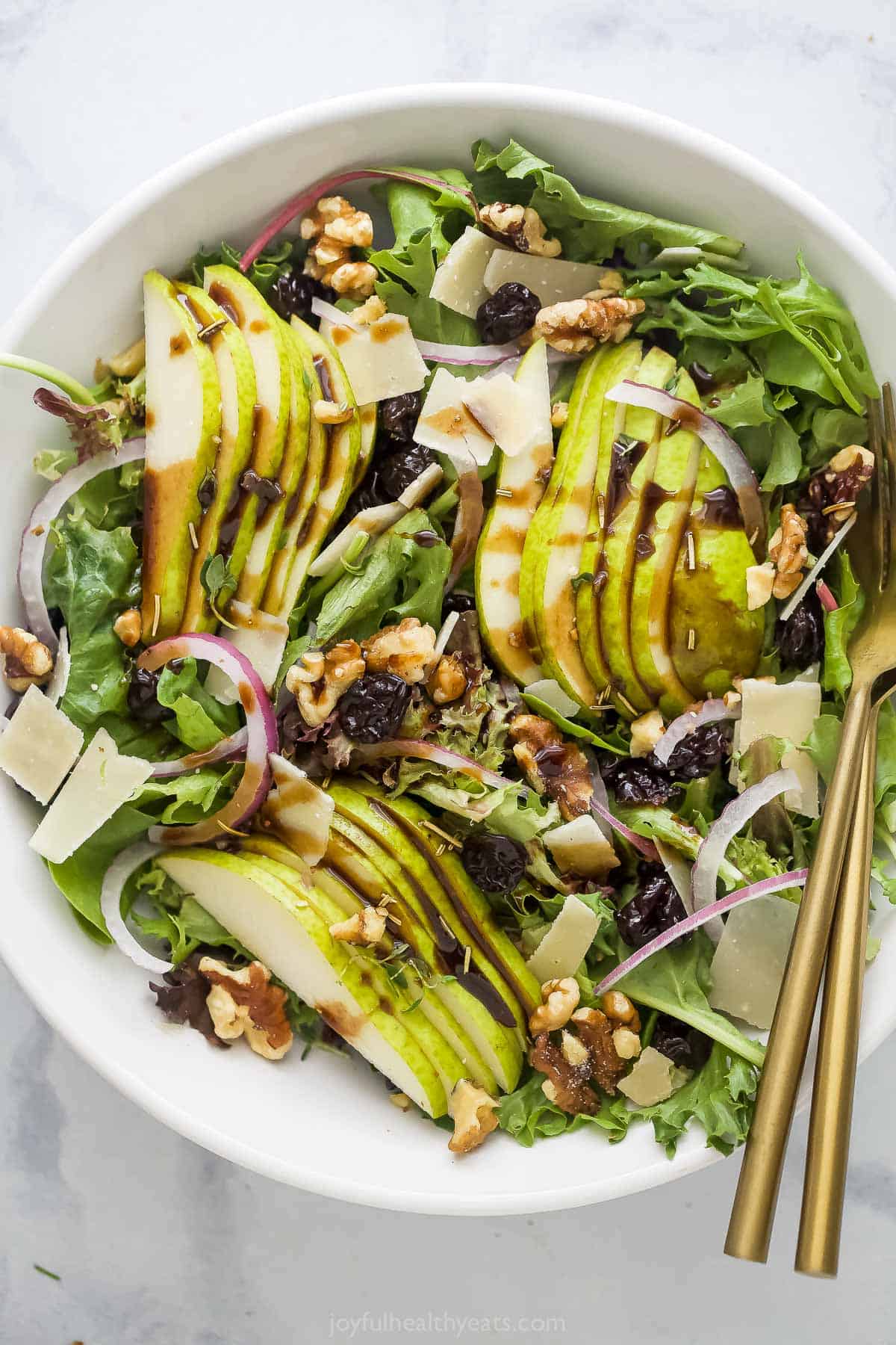 Large Bowl Pear Walnut Salad with Dried Cherries and Parmesan Cheese.