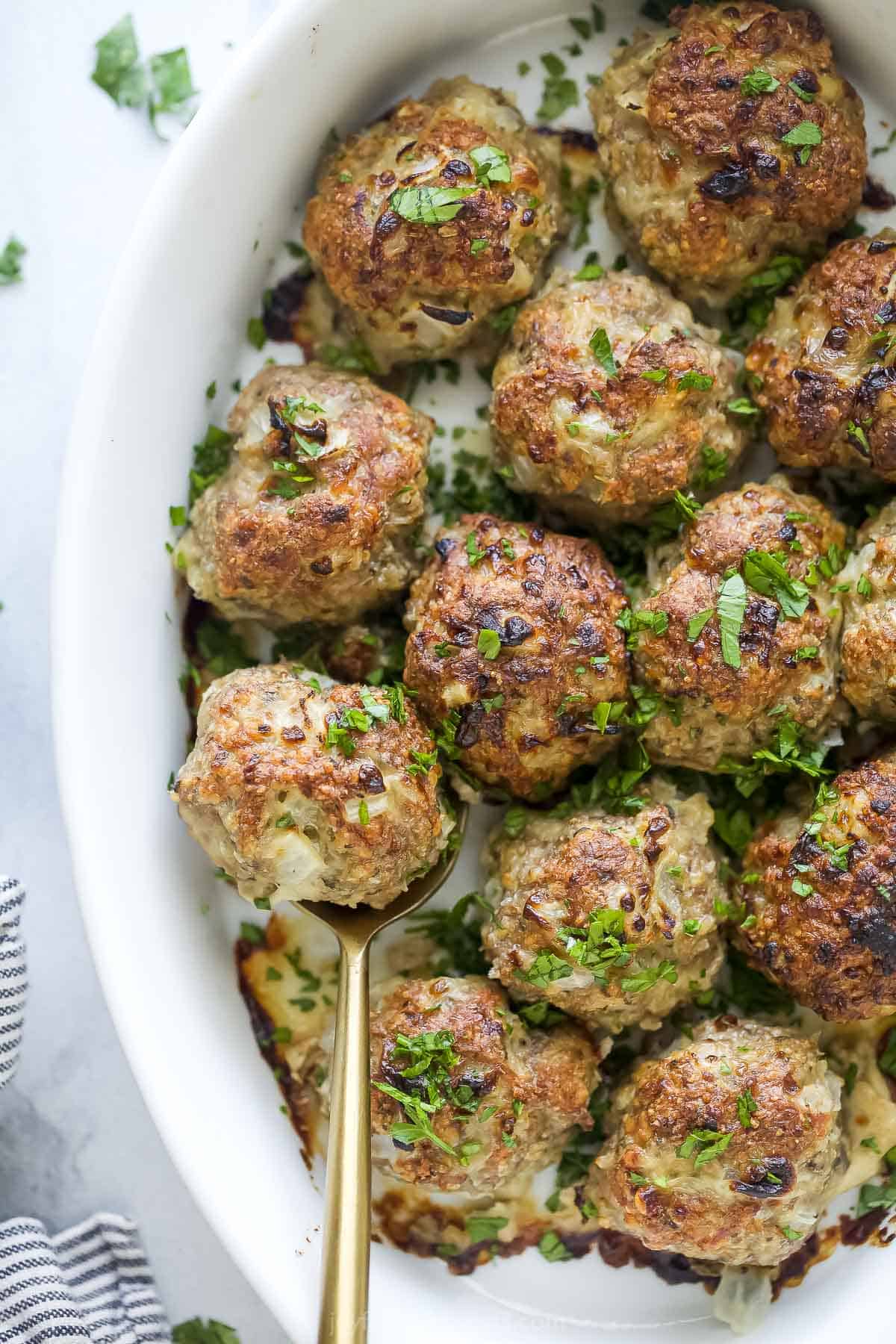 Juicy turkey meatballs with fresh parsley on top.