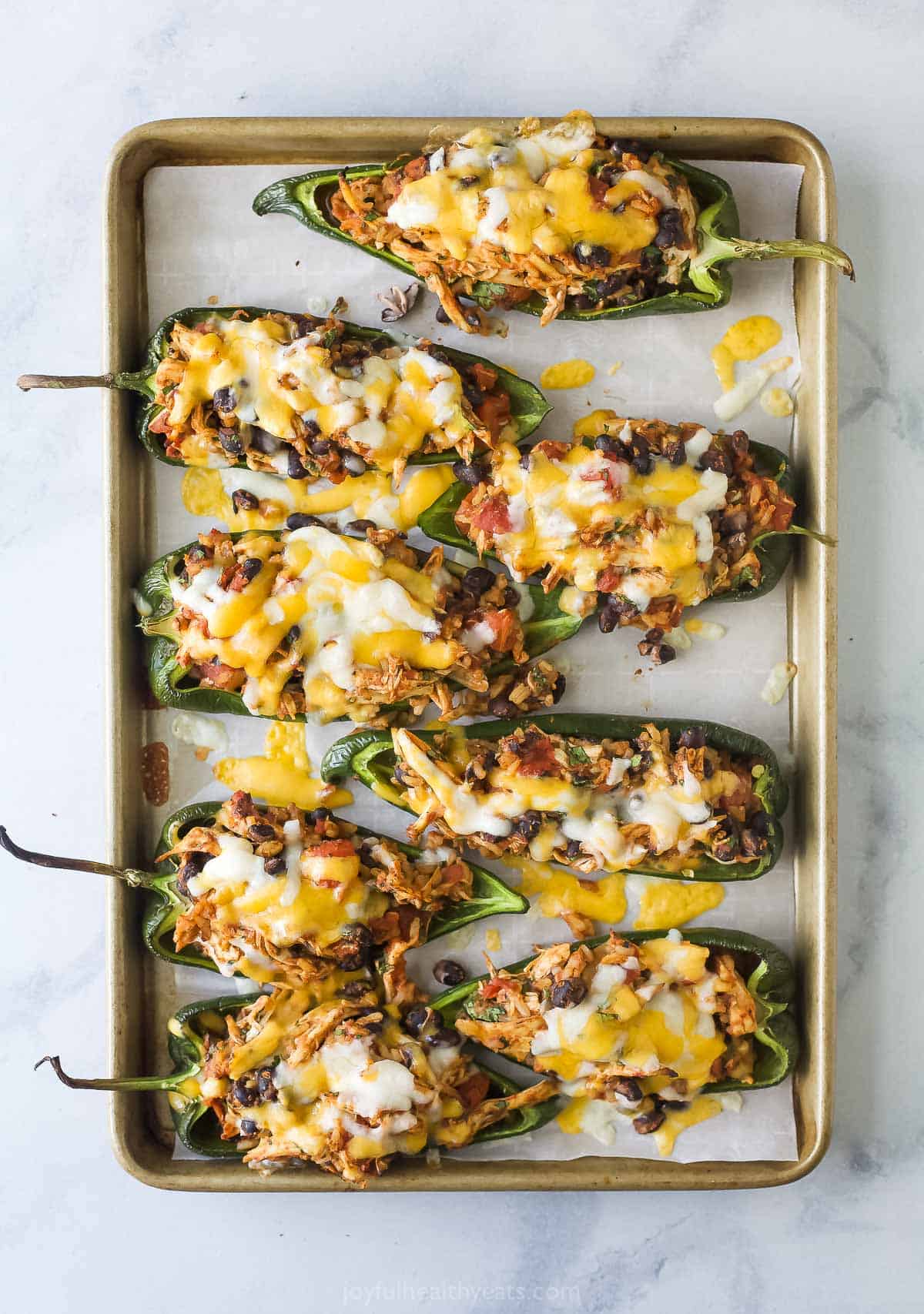 Freshly baked poblanos with chicken-bean filling and melty Mexican cheese. 