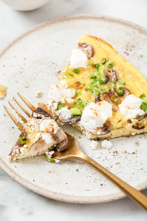 Dig into a slice of fluffy frittata with mushrooms and goat cheese.