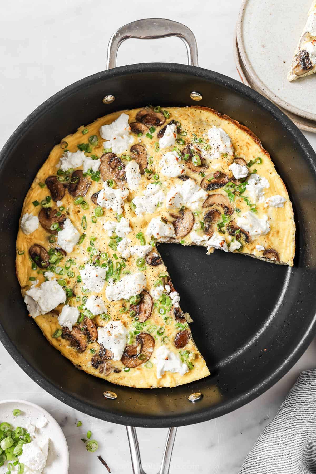 Whole mushroom frittata minus one slice in the skillet. 