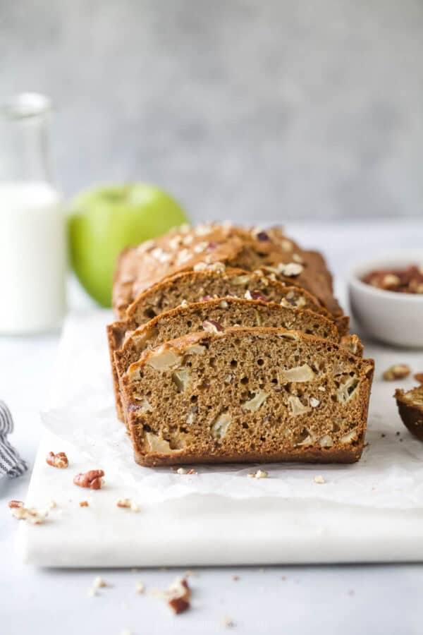 Sliced apple bread with cinnamon and pecans.