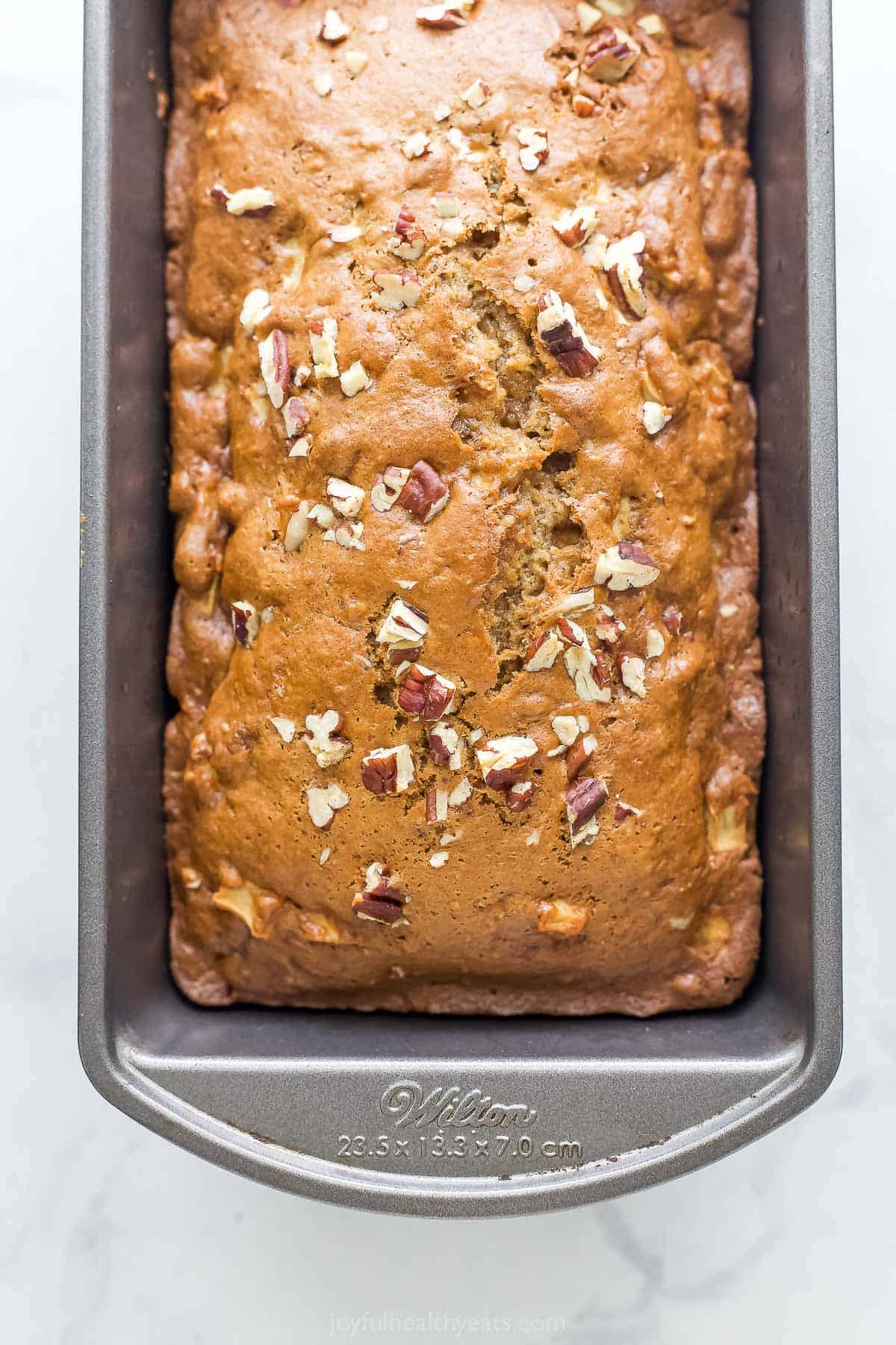 Golden, freshly-baked bread in the loaf pan. 