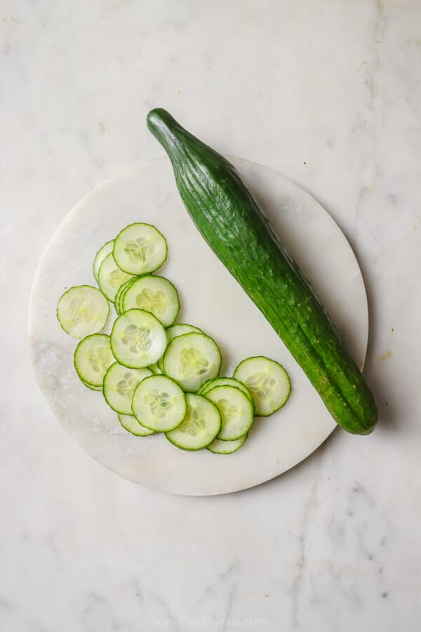 Slicing the cucumber. 