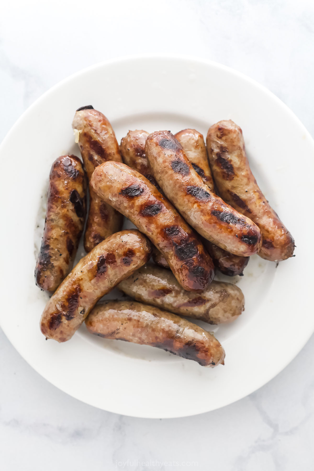 Grilled beer brats with grill marks. 