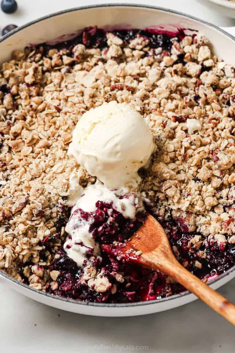 Blueberry cobbler with a scoop of vanilla ice cream.