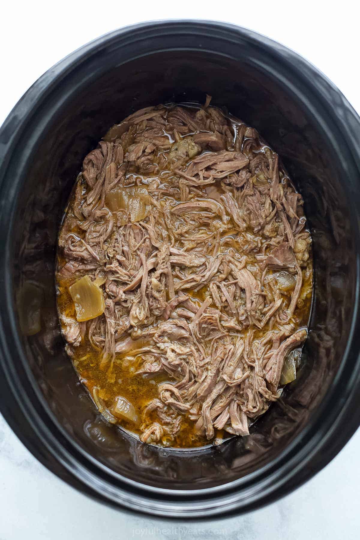 Shredded beef in the crockpot. 