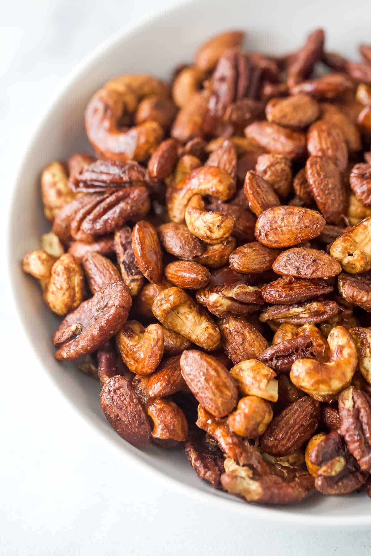 Close-up of crunchy spiced nuts candied with maple syrup.