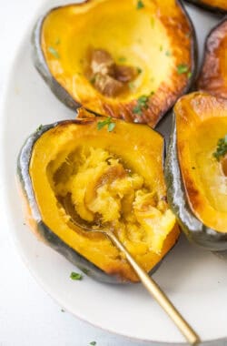 Digging into a roasted acorn squash with butter and brown sugar.