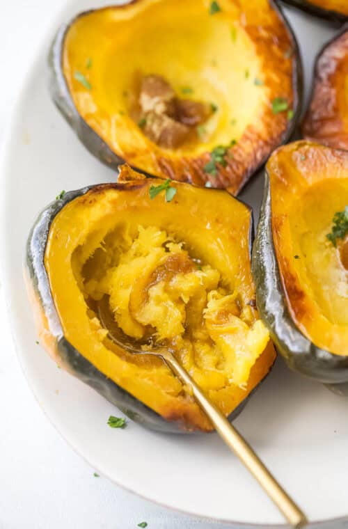 Digging into a roasted acorn squash with butter and brown sugar.