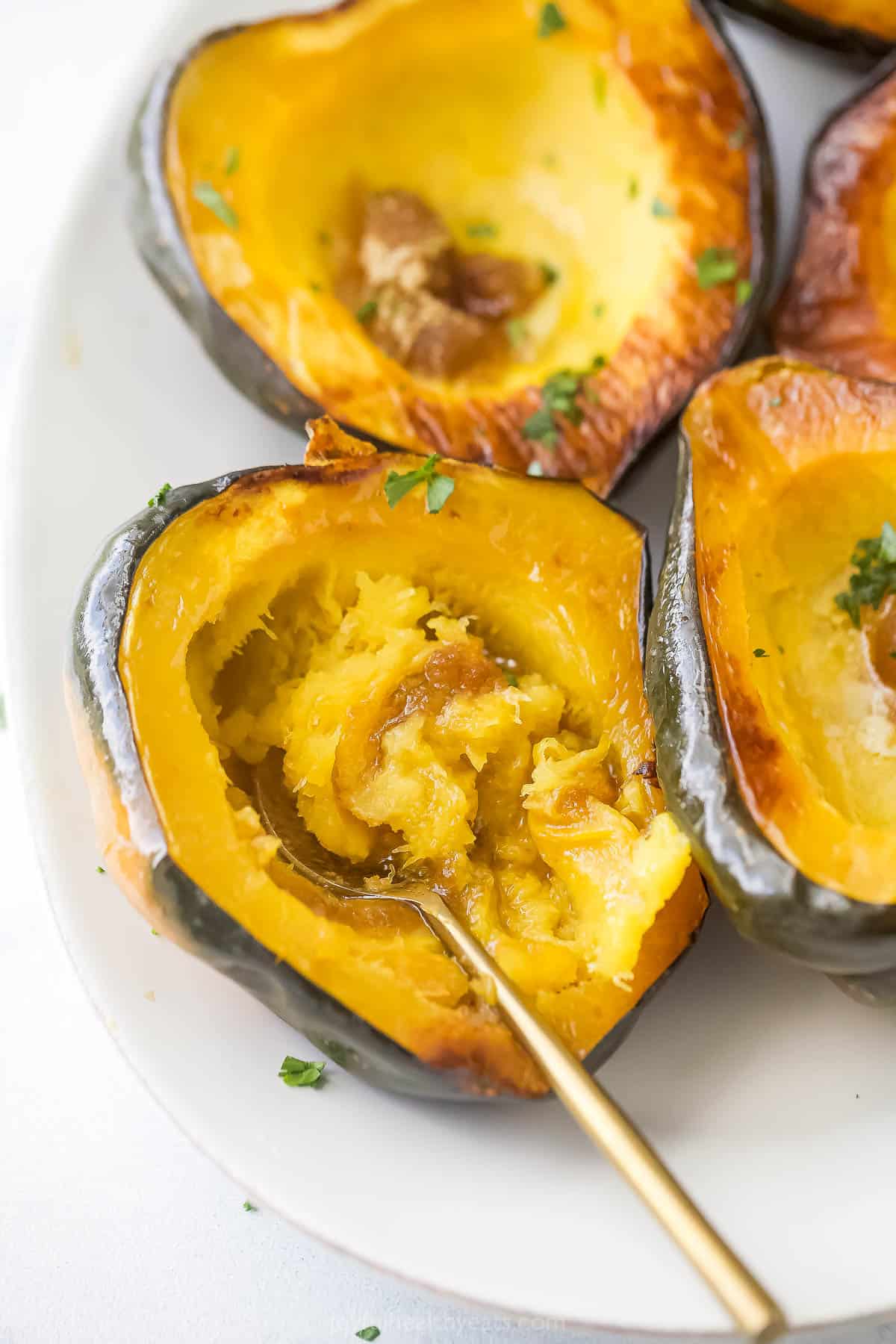 Digging into a roasted acorn squash with butter and brown sugar.