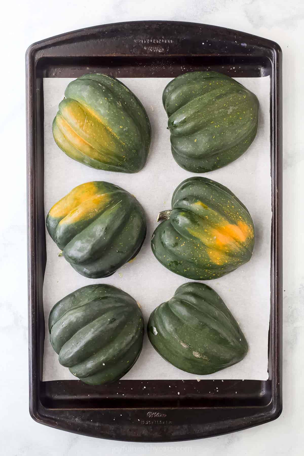 Acorn squash on the prepared baking sheet right before roasting. 