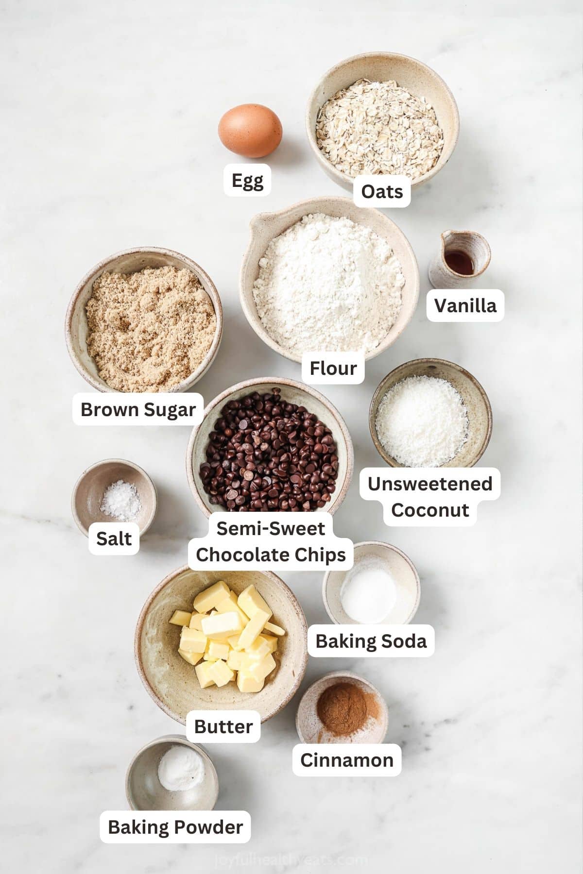 Labeled ingredients for coconut chocolate chip oatmeal cookies.