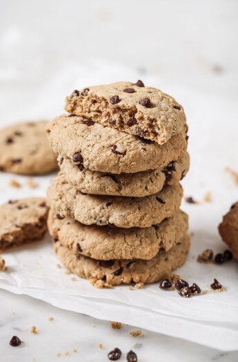 A stack of freshly-baked coconut chocolate chip oatmeal cookies.