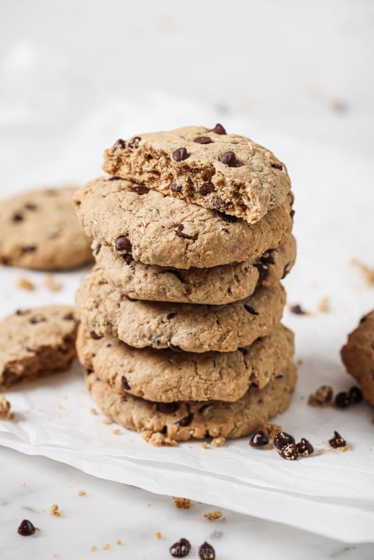 A stack of freshly-baked coconut chocolate chip oatmeal cookies.