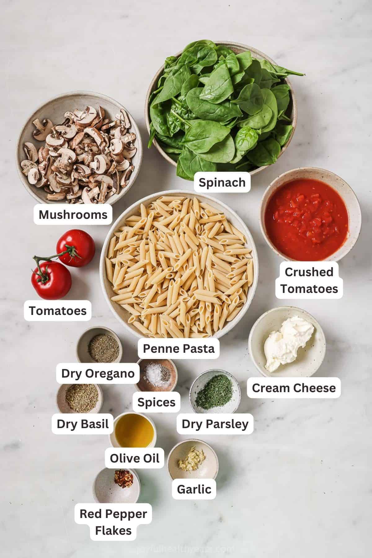 Labeled ingredients for spinach mushroom pasta. 