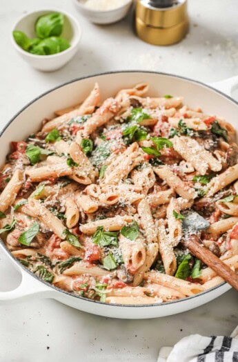 Creamy spinach mushroom pasta in the skillet.