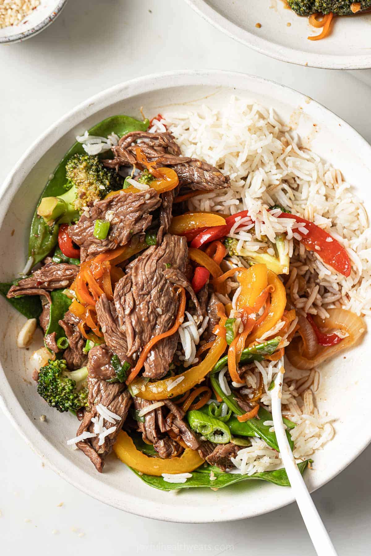 Saucy beef and veggie stir fry over fluffy rice. 