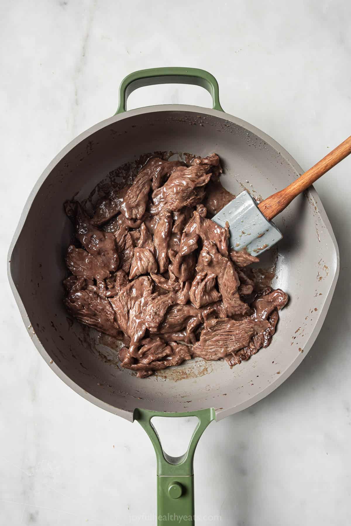 Browning the beef in the skillet. 