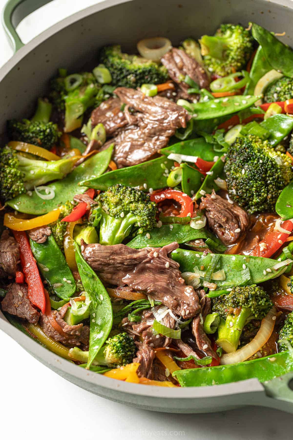 Angled photo of the steak stir fry recipe in the skillet. 