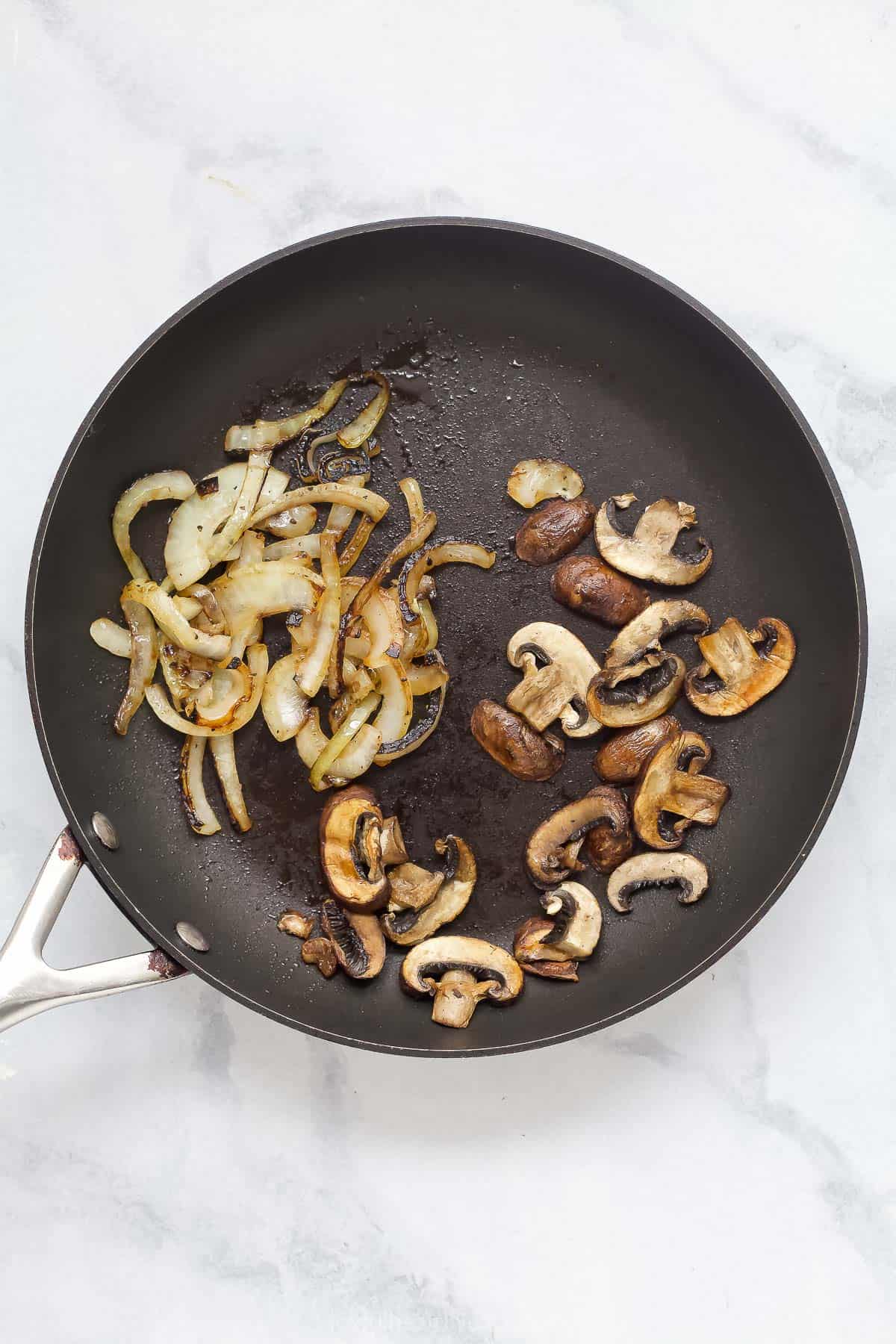 Onions and mushrooms cooked in skillet