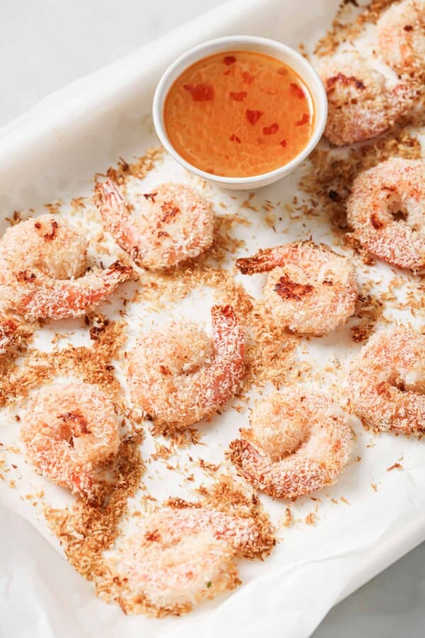 Baked coconut shrimp with homemade Thai chili-ginger sauce on the side for dipping.