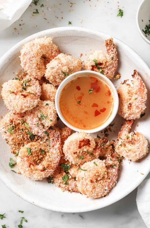 Serving plate with coconut shrimp and Thai ginger-garlic sauce.