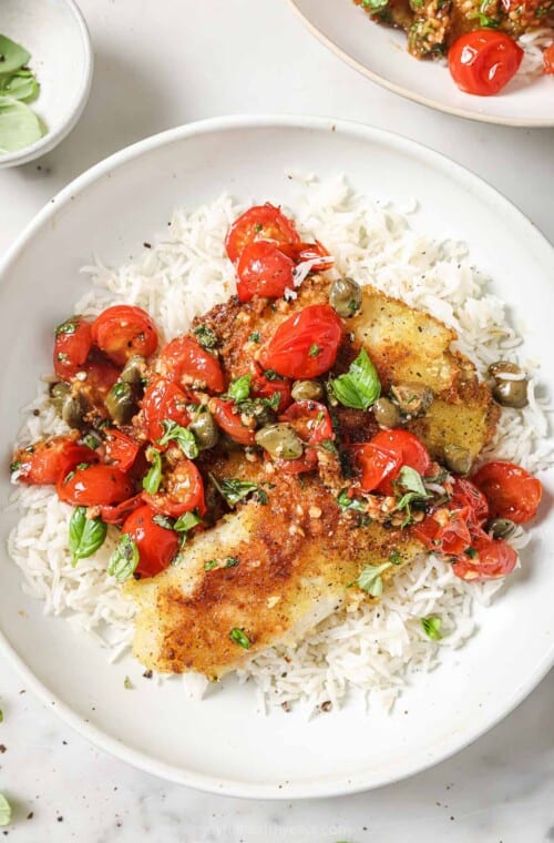 Panko crusted tilapia with homemade tomato-basil sauce over fluffy rice.