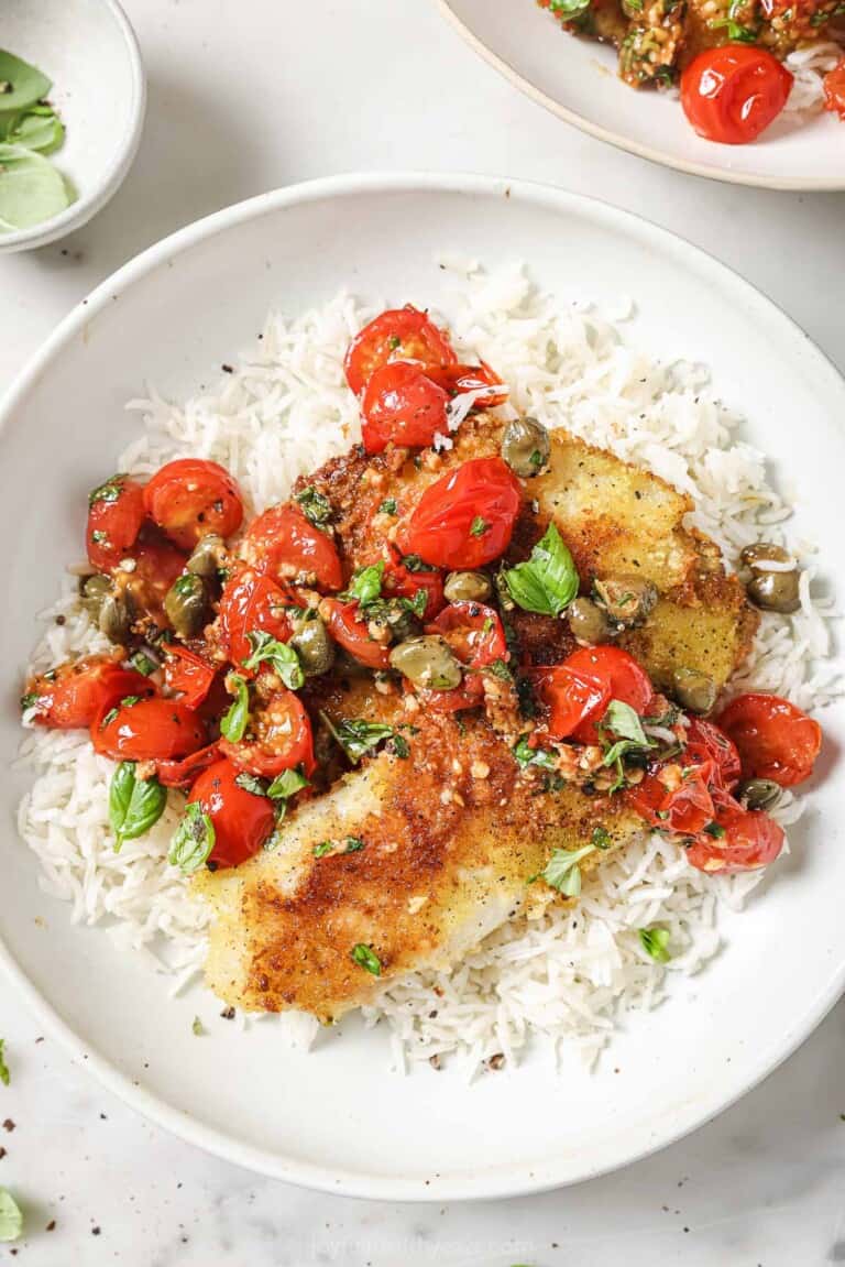 Panko crusted tilapia with homemade tomato-basil sauce over fluffy rice.