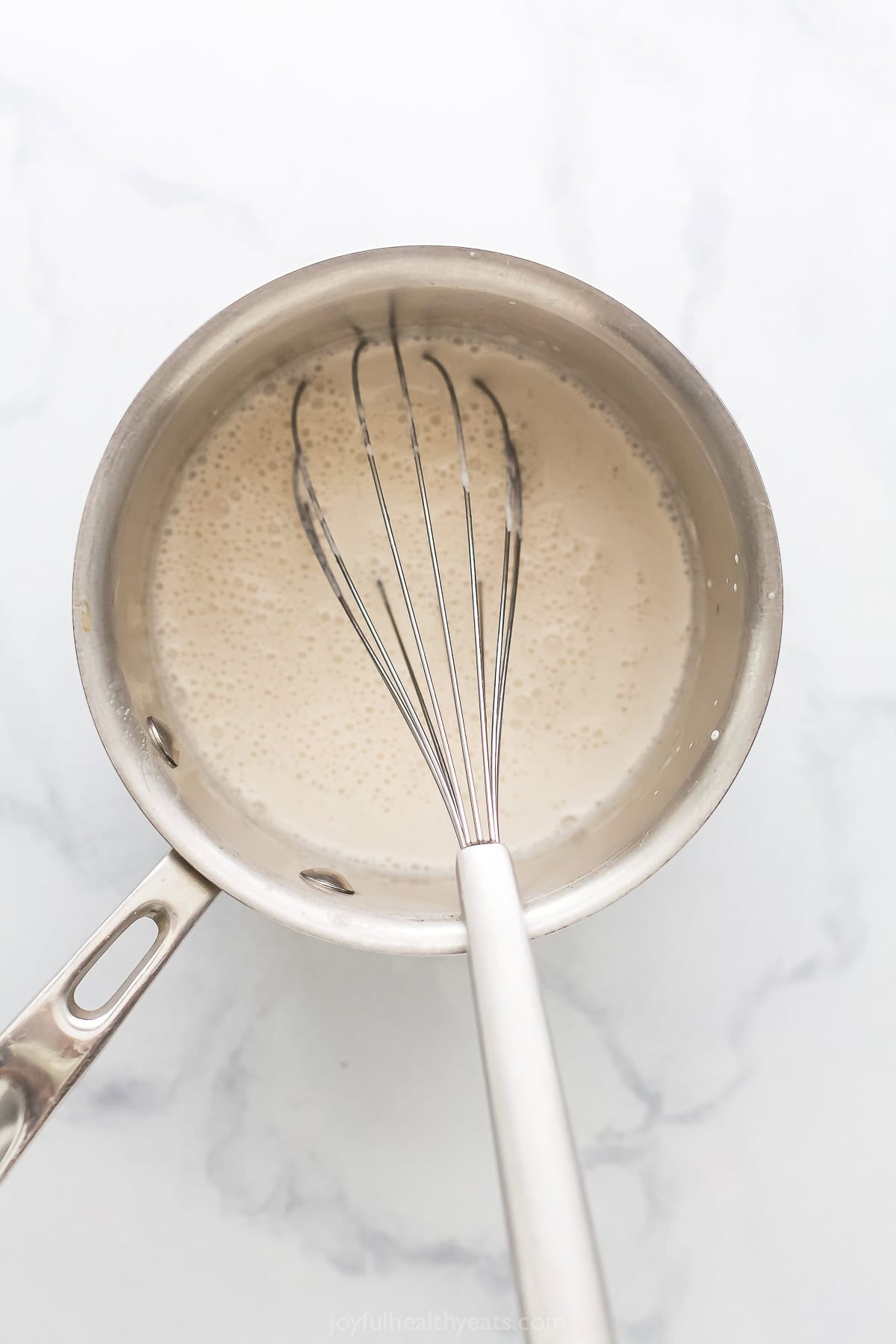 Whisking the coconut-gelatin mixture.