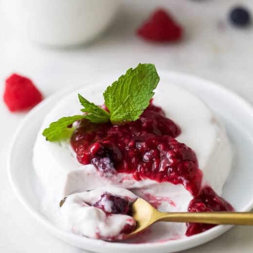 Close-up of coconut panna cotta with berry compote.