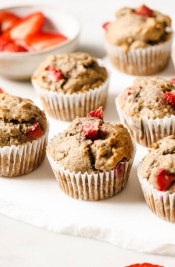 Freshly baked strawberry banana muffins on the counter.