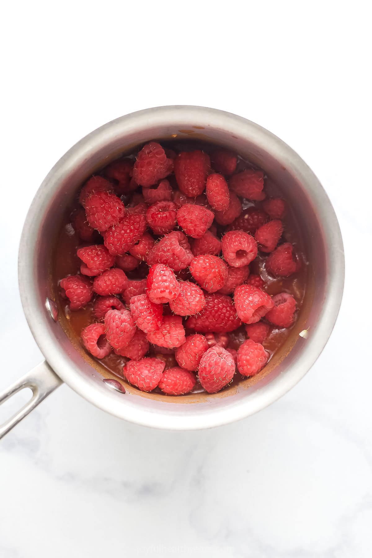 Stirring in the raspberries. 