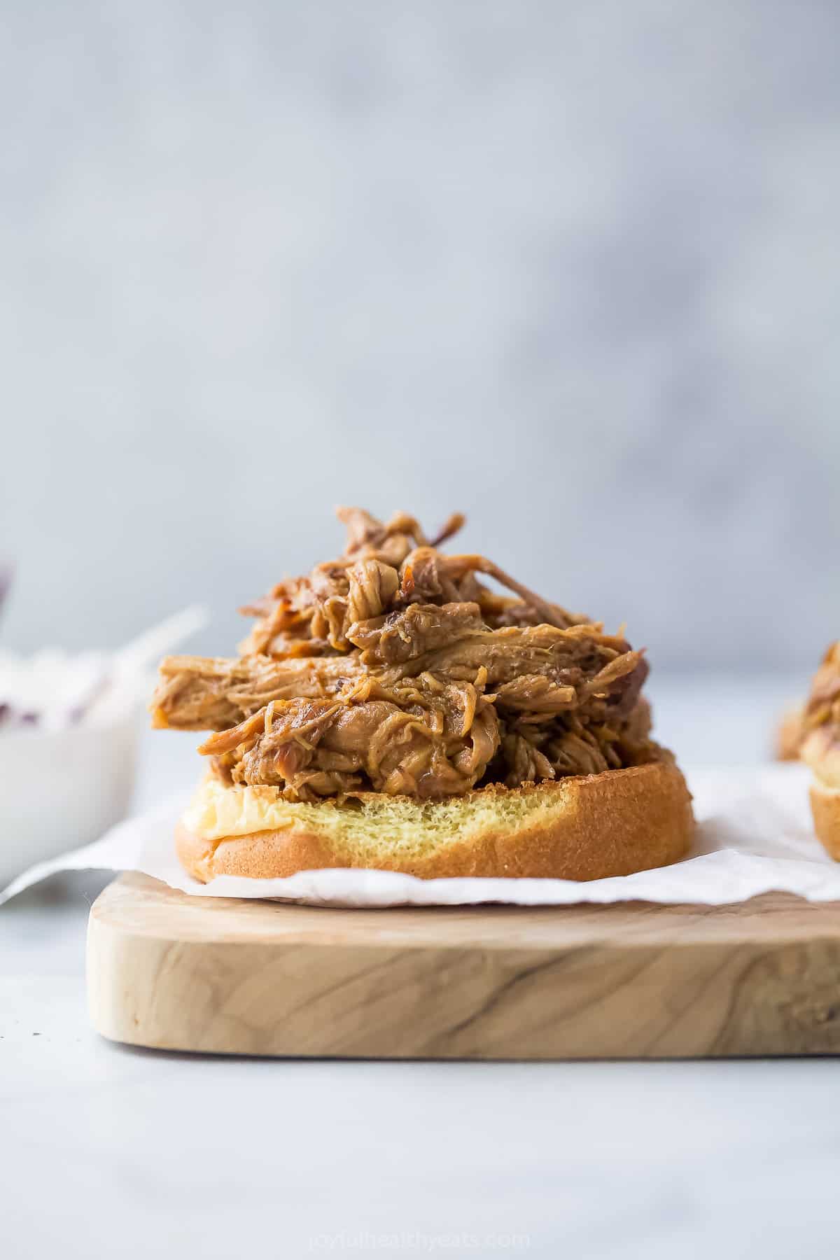 Pulled pork piled onto bottom half of bun