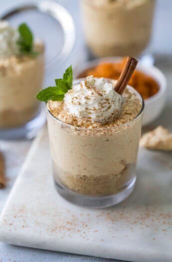 No bake pumpkin cheesecake with Cool Whip and cinnamon on top.