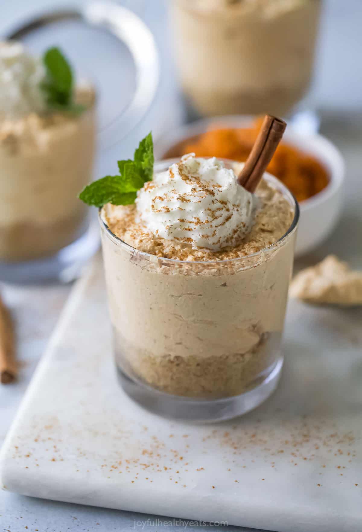 No Bake Pumpkin Cheesecake with Cool Whip and Cinnamon on Top.