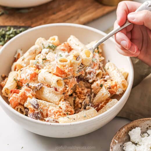 Landscape photo of creamy goat cheese pasta.