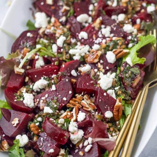 Roasted beet salad with goat cheese on platter