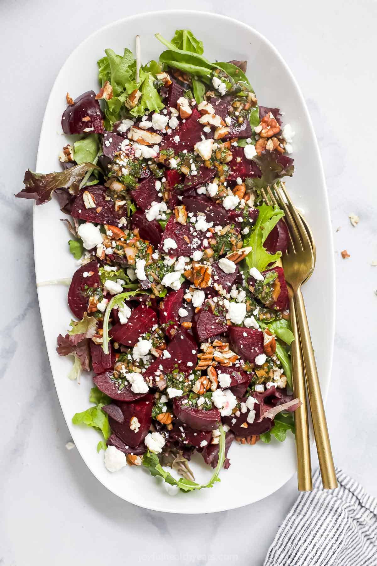 Overhead view of roasted beet salad with goat cheese