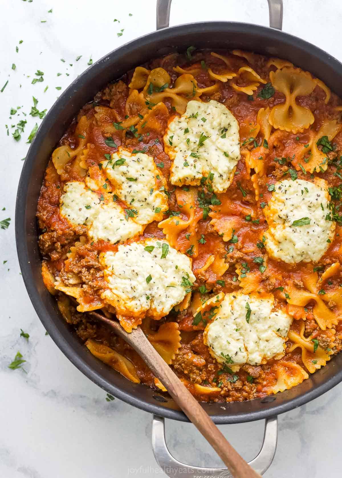 Skillet lasagna with dollops of homemade parmesan-ricotta mixture on top. 