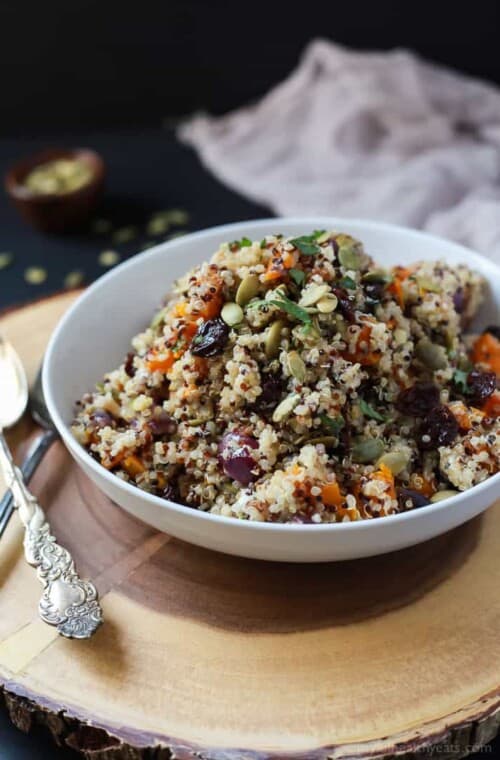 The BEST Roasted Butternut Squash Quinoa Salad with a secret creamy element and surprise spice that makes this salad dish pop with flavor. This Quinoa Salad is a rock star gluten free vegetarian recipe you need on your table this fall. | joyfulhealthyeats.com #recipes Easy Dinner Recipes