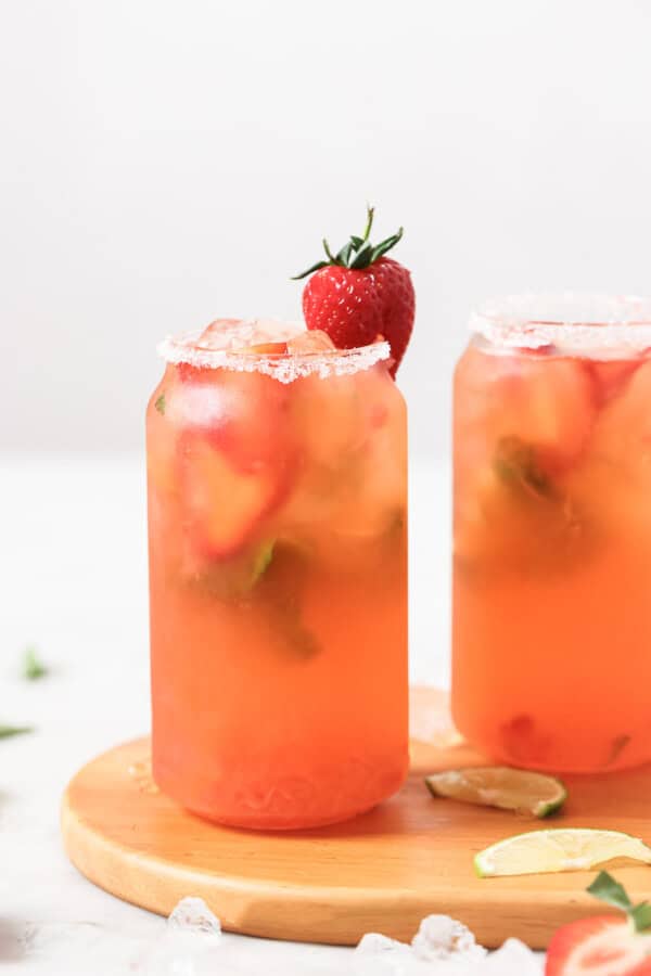 Two strawberry mojitos with ice.