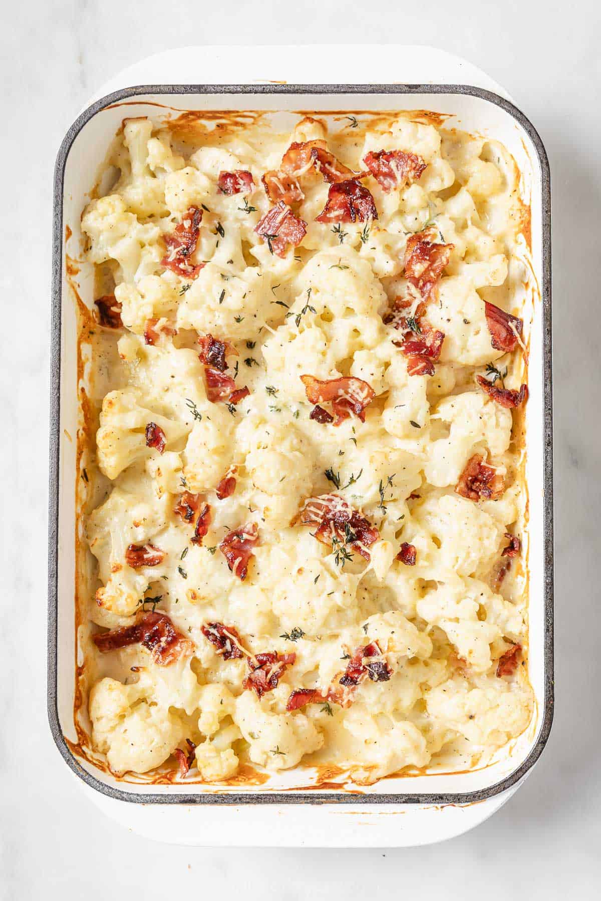 Baked, creamy cauliflower casserole in the baking dish. 