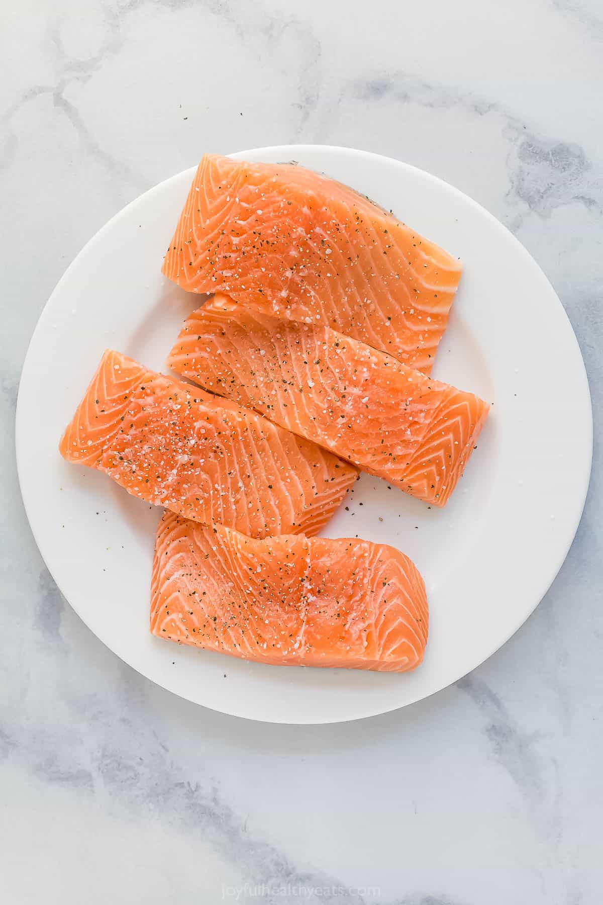 Seasoned salmon on plate