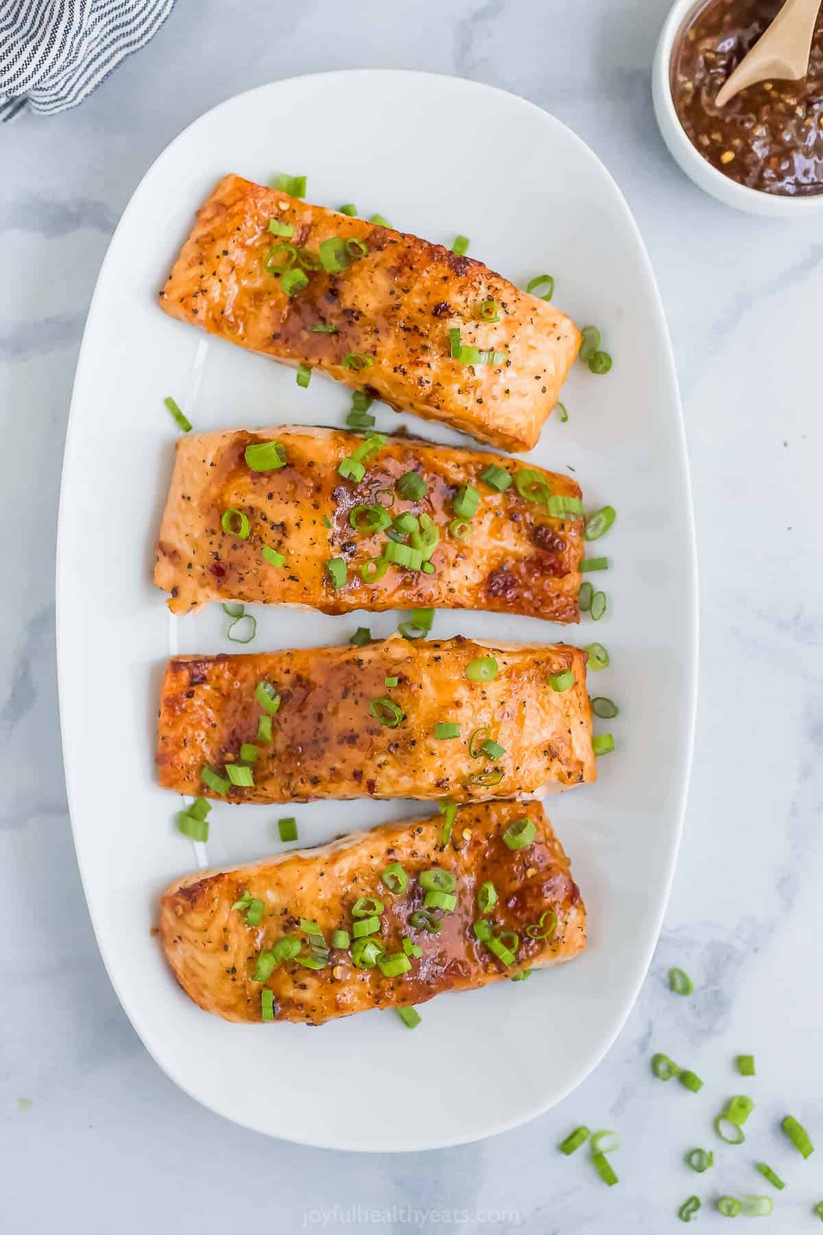 Overhead view of air fryer sweet chili salmon on platter