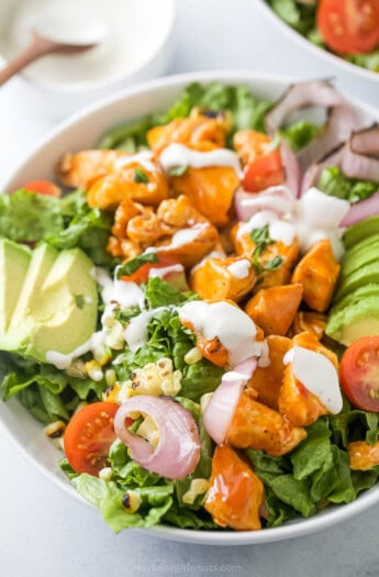Buffalo chicken salad with Ranch dressing in a bowl.
